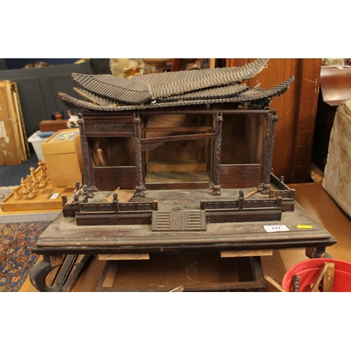 177 - Wooden model of a Chinese temple and seven finely carved figures.  (af)