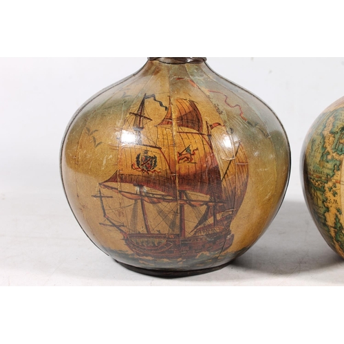 235 - Pair of glass and leather bound decanters decorated with galleons and maps.