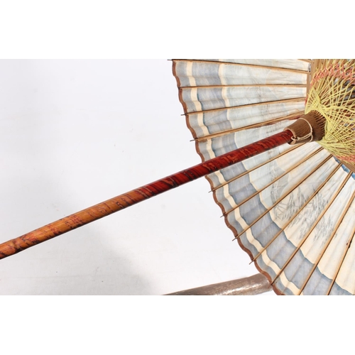 24 - Oriental painted paper and lacquered parasol with original metal cover.