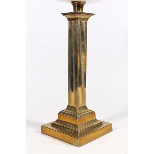 27 - Brass reeded column and glass oil lamp, 77cm high.