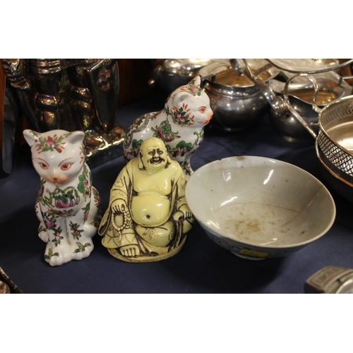 44 - Chinese blue and white bowl, pair of famille rose cats, and a Buddha figure.