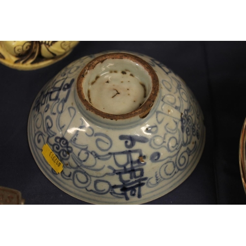 44 - Chinese blue and white bowl, pair of famille rose cats, and a Buddha figure.