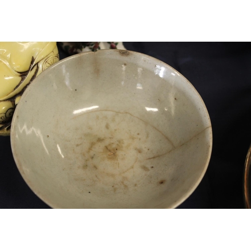 44 - Chinese blue and white bowl, pair of famille rose cats, and a Buddha figure.