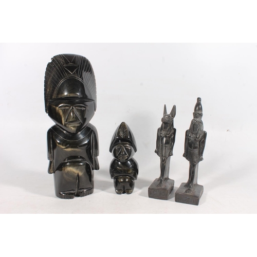 48 - South American obsidian carved figure, another smaller, and two Egyptian deity figures.