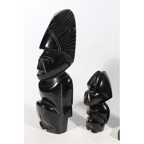 48 - South American obsidian carved figure, another smaller, and two Egyptian deity figures.