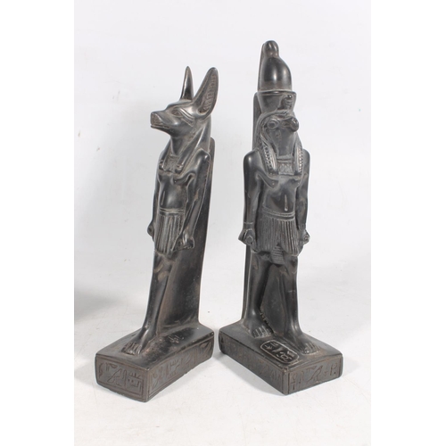 48 - South American obsidian carved figure, another smaller, and two Egyptian deity figures.