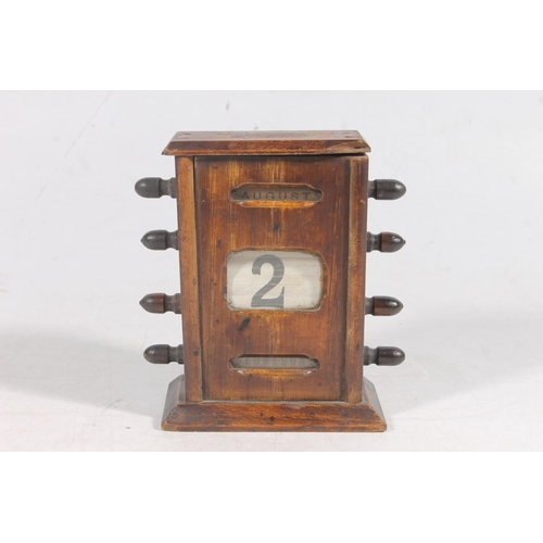 5 - Oak cased perpetual calendar, 15.5cm high.