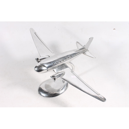 64 - Chrome model of an aircraft