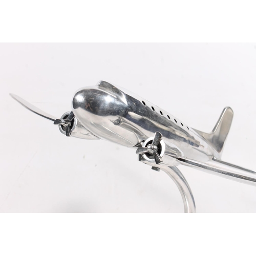 64 - Chrome model of an aircraft