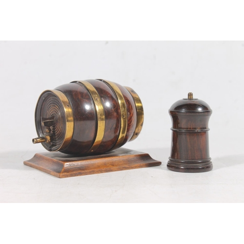 8 - Treen string cutter in the form of a banded whisky barrel and a treen pepper pot.  (2)