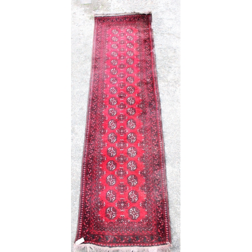 906 - Afghan Bokhara red ground runner, 270cm x 78cm.