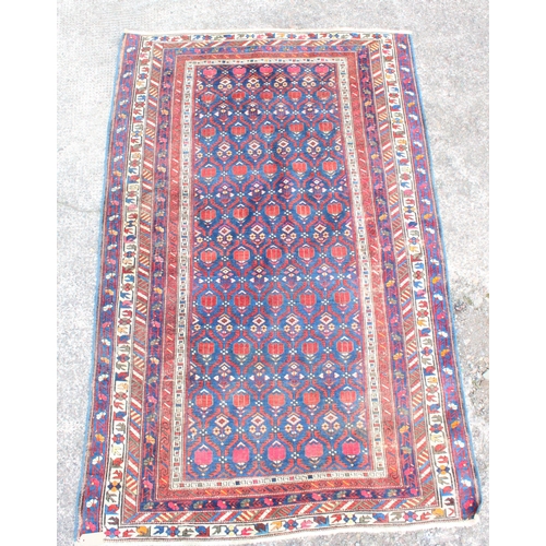 909 - Caucasian Kuba type polychrome rug, 195cm x 125cm.