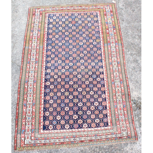 910 - Caucasian polychrome rug with geometric flower motifs, 