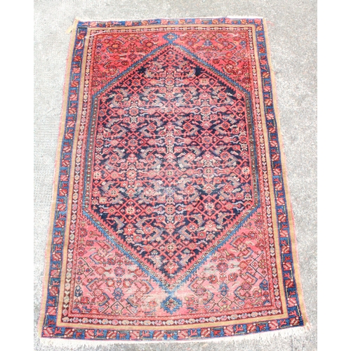 918 - Persian red ground rug, 194cm x 130cm.