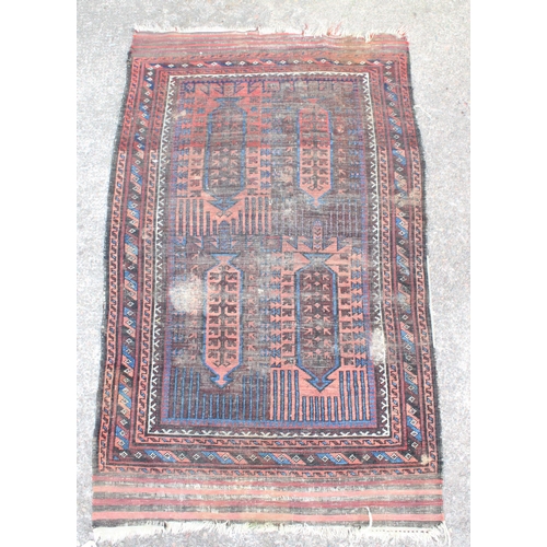 920 - Afghan Baluch type red and blue rug, 196cm x 110cm.