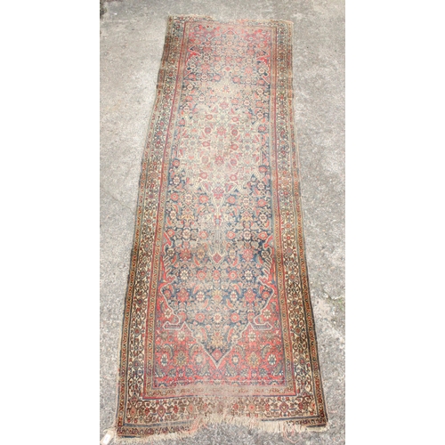 928 - Persian polychrome runner with floral and geometric motifs, 315cm x 101cm.