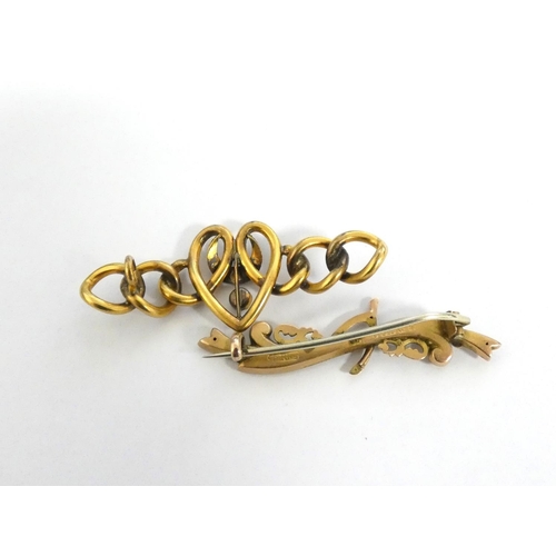 77B - A 9ct gold bar brooch one with central wishbone, along with a yellow metal curb link heart broo... 