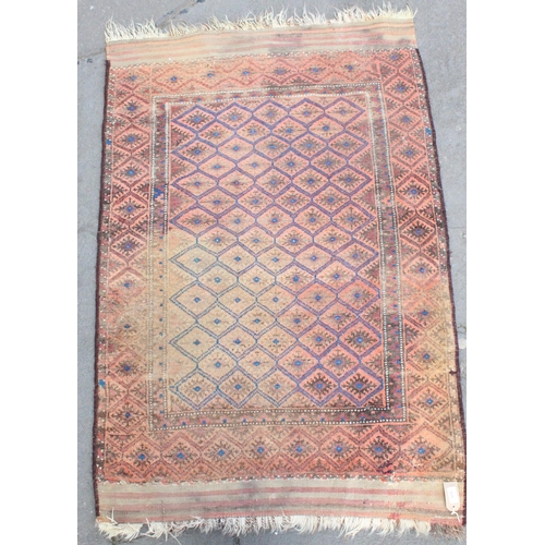 936 - Middle Eastern blue ground and red rug with geometric lozenge shaped designs, 137cm x 95cm.