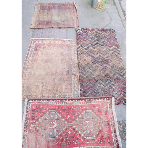 938 - Four Oriental and Middle Eastern small rugs, max 160cm x 80cm.