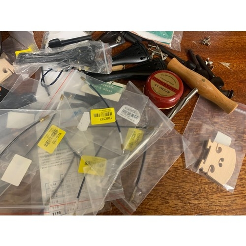 427A - Violin accessories to include sets of strings, pegs, bridges, etc.