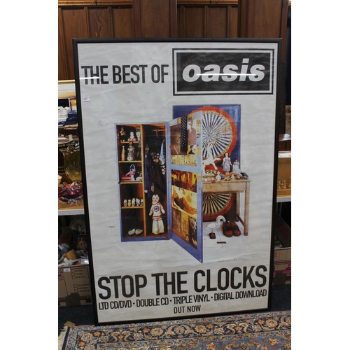 417 - The Best of Oasis, Stop The Clocks in a large framed poster.