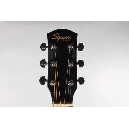 439 - Squire by Fender acoustic guitar in soft case.