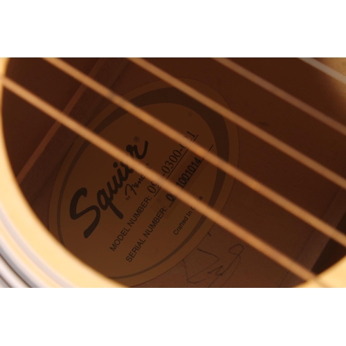 439 - Squire by Fender acoustic guitar in soft case.