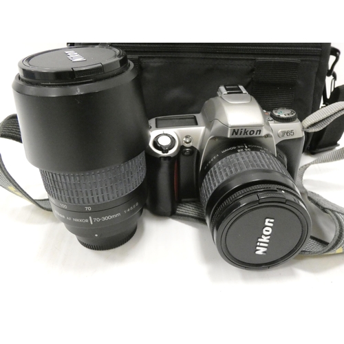 15 - Group of cameras to include a Nikon F65 with lens, Cosina VAF, and others by Samsung, Kodak and Cano... 