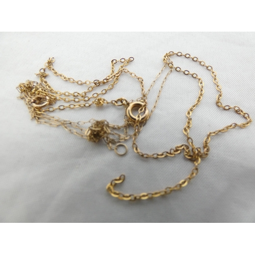 26 - 9k gold chains, entwined, 1.47g gross, and an unmarked name brooch, 'Bertha'.