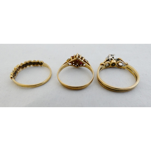 31 - Three 9ct gold ladies' dress rings set with gemstones and synthetic stones, sizes M, K and M, 4.5g g... 