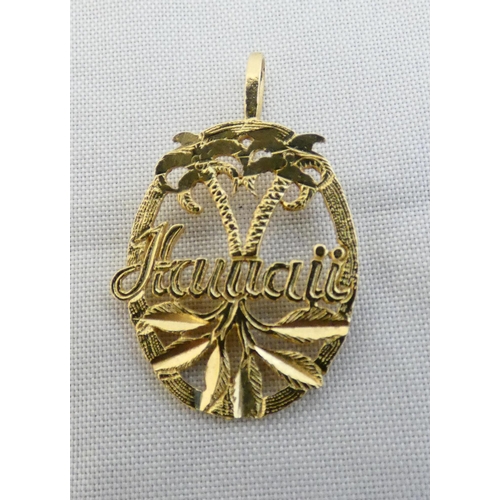 32 - 14k gold lady's pendant, 'Hawaii', 1g, and two other ladies' brooches.  (3)