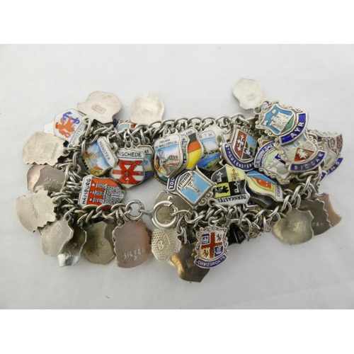 34 - Sterling silver (925) and enamel bracelet set with multiple enamel crested pendants of mainly Scotti... 