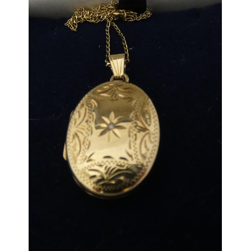 37 - 9ct gold lady's oval locket set with a small brilliant to the obverse, attached to a 9k gold chain, ... 