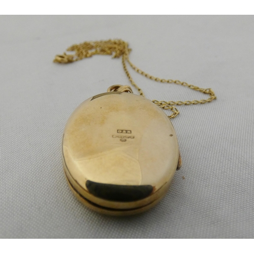 37 - 9ct gold lady's oval locket set with a small brilliant to the obverse, attached to a 9k gold chain, ... 