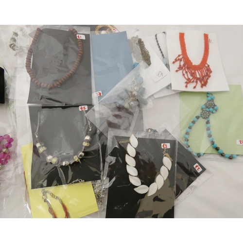 47 - Quantity of ladies' costume jewellery, mainly chains with attached pendants, mostly in original pack... 