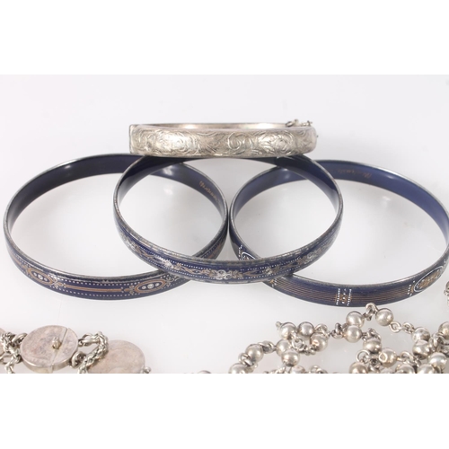 777 - Three Michaela Frey bangles, a silver bangle 17g, a coin art bracelet made from Victorian groats 21g... 