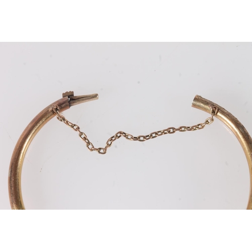 778 - Baby's 8ct gold bangle, the clasp stamped '333', 3.8g.