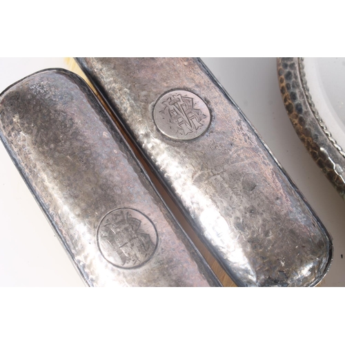 824 - Four piece hallmarked silver vanity set of mirror and three brushes.