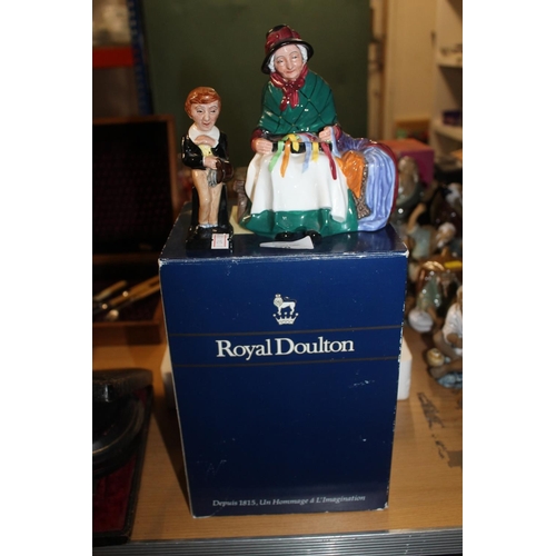 340 - Two Royal Doulton figures to include David Copperfield and a boxed Ribbon Seller. (2)