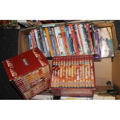 349 - Three boxes of DVDs to include John Wayne along with Western film books, etc.