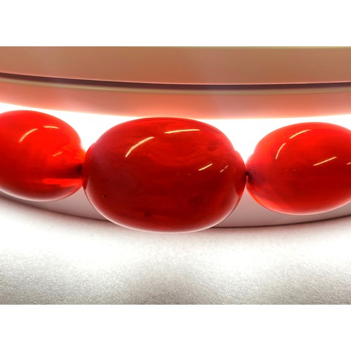 78 - Cherry amber string of graduated beads, 76cm long, 73.8g.