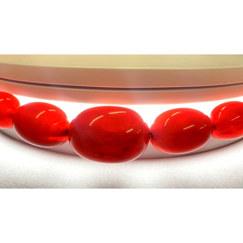 78 - Cherry amber string of graduated beads, 76cm long, 73.8g.