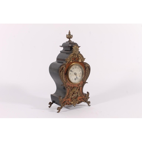 283 - German Lenzkirch mantel clock, early 20th century, the rococo shaped case with urn finial, applied b... 