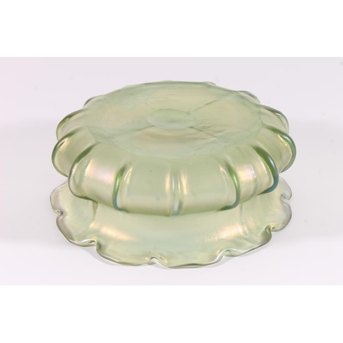 303 - Loetz iridescent glass bowl, early 20th century, the shaped rim over a ribbed squat body, W20cm.