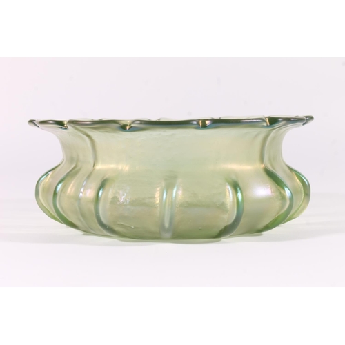 303 - Loetz iridescent glass bowl, early 20th century, the shaped rim over a ribbed squat body, W20cm.