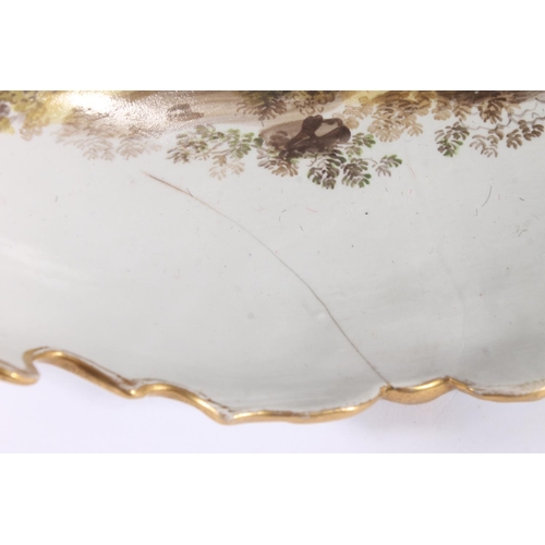 307 - English porcelain dinner ware, 19th century, the shaped gilt and white bodies painted with landscape... 