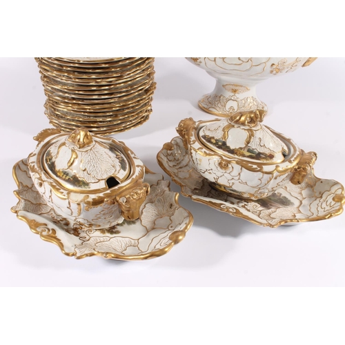 307 - English porcelain dinner ware, 19th century, the shaped gilt and white bodies painted with landscape... 