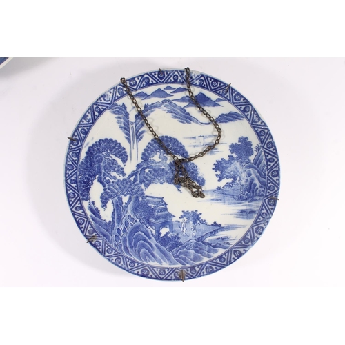 320 - Chinese porcelain willow pattern charger, late Qing period, decorated with a waterside scene within ... 