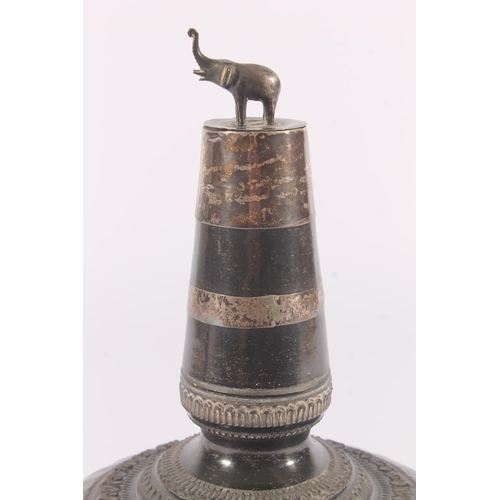 324 - Indian pottery and metal bound water bottle, early 20th century, the elephant finial lid over a tape... 