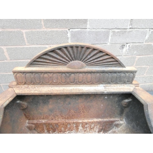 461 - Antique cast iron fire basket, with rising sun pediment, raised on scrolled supports. Height 62cm.